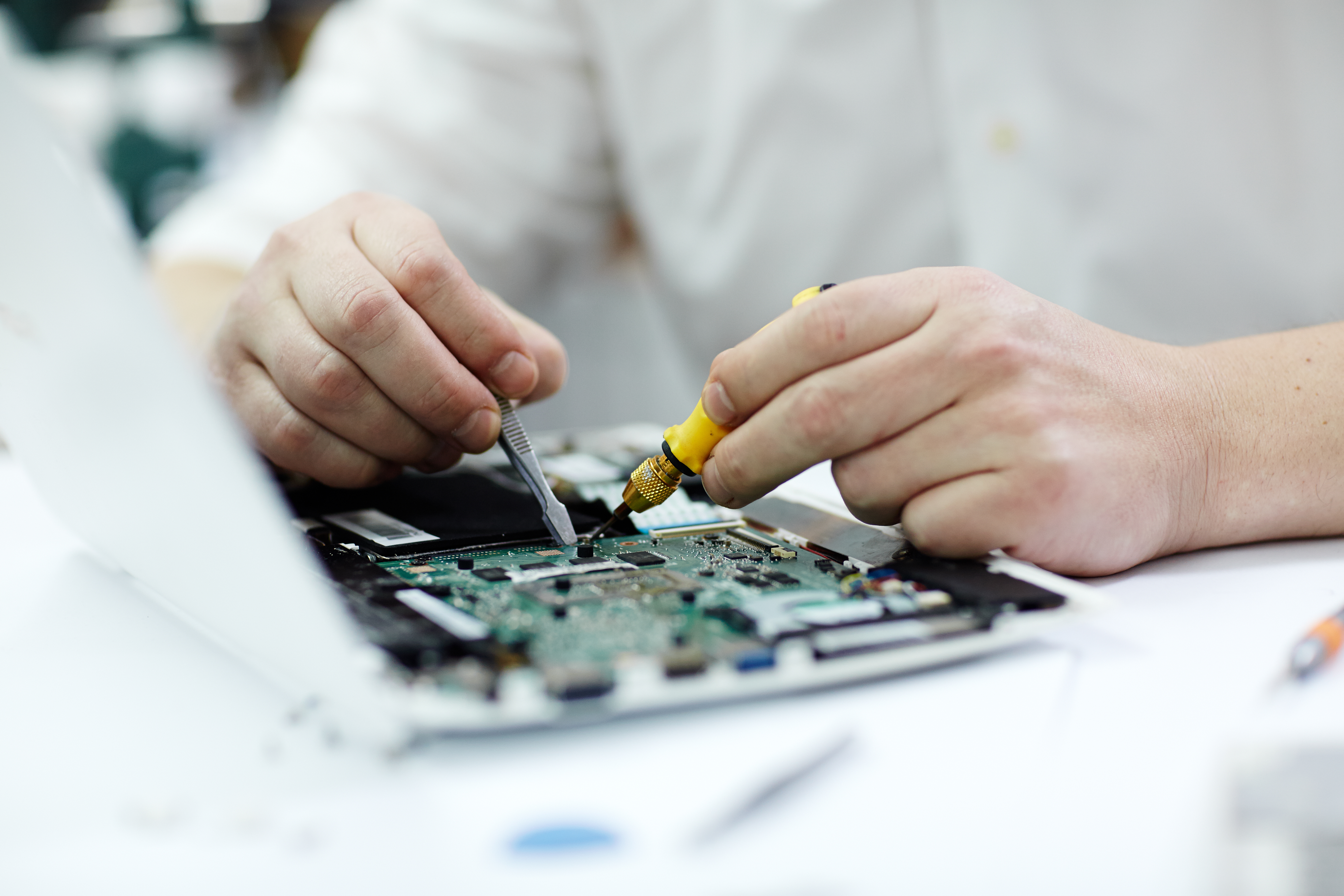 hands-on training in smartphone chip-level repair at Magnus Institute