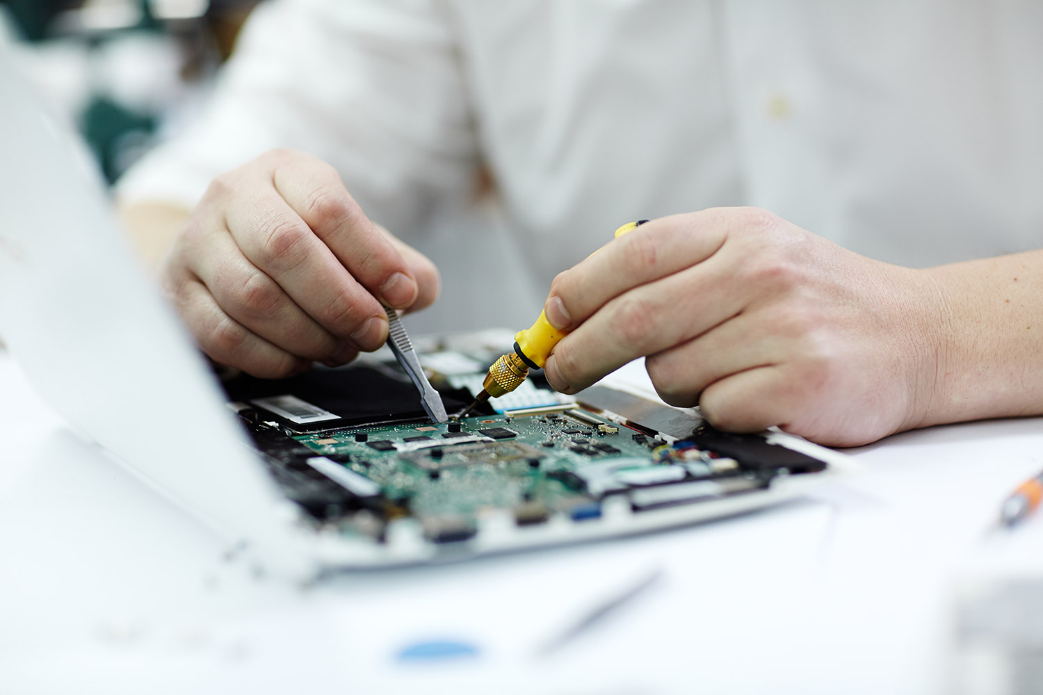 hands-on training in smartphone chip-level repair at Magnus Institute